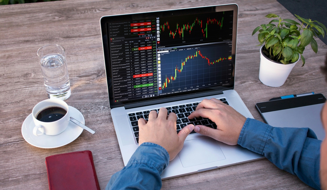 Forex trading chart with currency and shares data under analysis on screen
