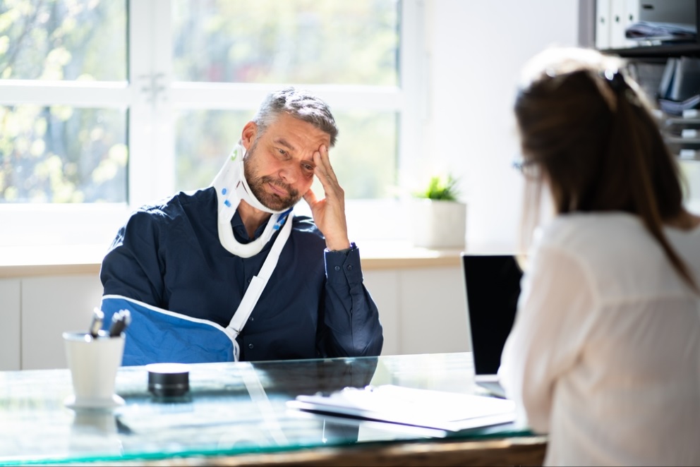 Professional TPD insurance claim lawyer in Brisbane office discussing claim process with client
